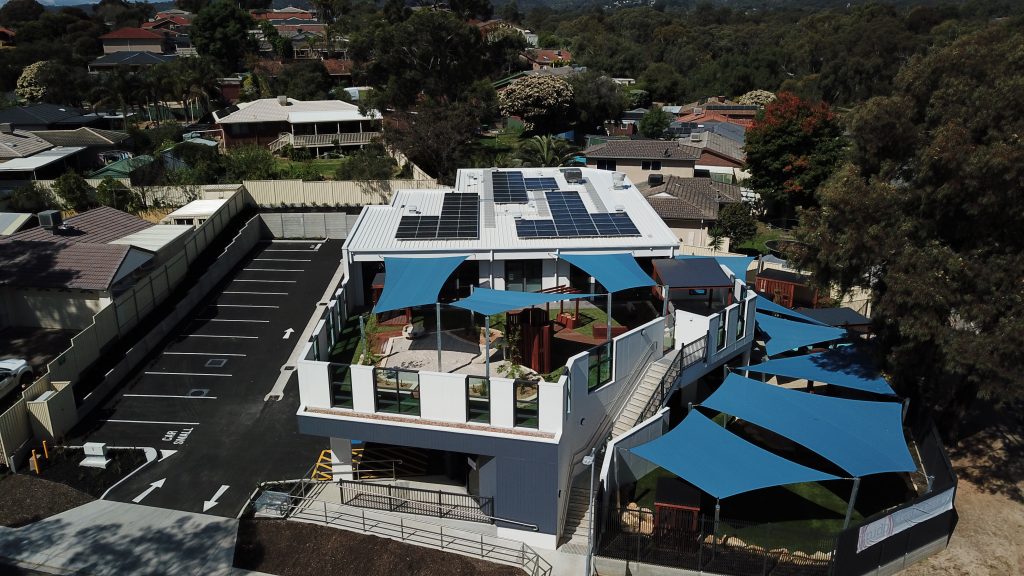 Nido Early School Top Front View of the Building with Solar Panel Rooftop