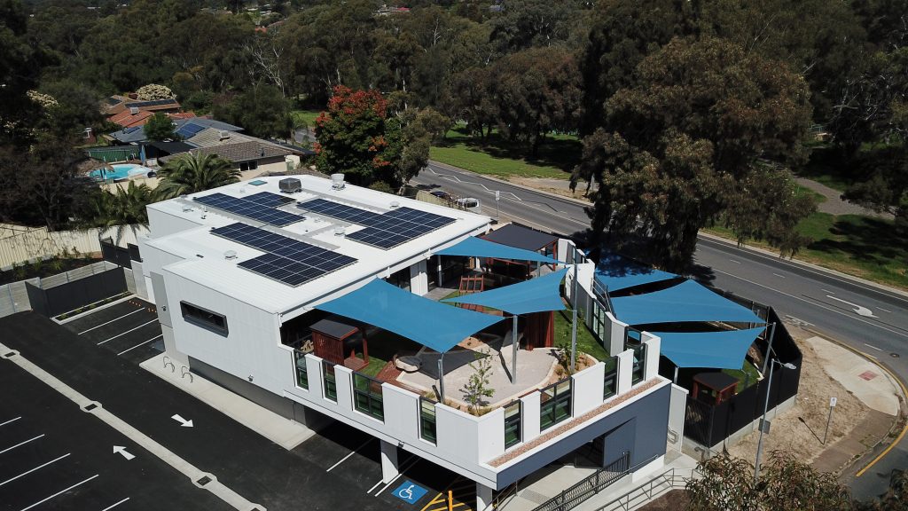 Nido Early School Top Left Close View of the Building with Solar Panel Rooftop